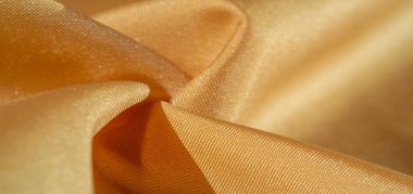 Doku, arka plan, ipek kumaş, sarı kehribar. Fotoğraf, bir moda tasarımcısının tasarımı, pazarlaması, mimarisi, çizimi, yerleşimi, çevresi için tasarlanmıştır.