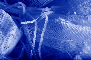 Doku, arka plan mavi tül. Bu olağanüstü naylon tülü kullanarak bir aksesuara hacim, yetenek ya da detaylı tasarım ayrıntıları ekleyin! Yumuşak tül tasarım gereksinimlerinizi karşılıyorsa, diğer kalıplara bakın