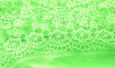 Doku, arkaplan, desen, kartpostal, ipek kumaş, dantel ambalajlı kadın bahar yeşil atkısı. Yazdırma ve dijital materyallerinizi oluşturmak için bu süslü resimleri kullanın.