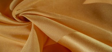 Doku, arka plan, ipek kumaş, sarı kehribar. Fotoğraf, bir moda tasarımcısının tasarımı, pazarlaması, mimarisi, çizimi, yerleşimi, çevresi için tasarlanmıştır.