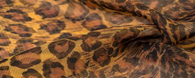doku, ipek kumaş, leopar derisi, kahverengi-sarı siyah tonlar, sıcak Afrika safarisi,