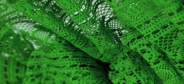 Arkaplan, doku, desen, yeşil dantel kumaş, ince açık kumaş, genellikle pamuktan ya da ipekten yapılmış, halkalar, bükme ya da örgü iplikleri kullanarak desenler halinde yapılmış.