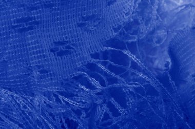 Doku, arka plan mavi tül. Bu olağanüstü naylon tülü kullanarak bir aksesuara hacim, yetenek ya da detaylı tasarım ayrıntıları ekleyin! Yumuşak tül tasarım gereksinimlerinizi karşılıyorsa, diğer kalıplara bakın