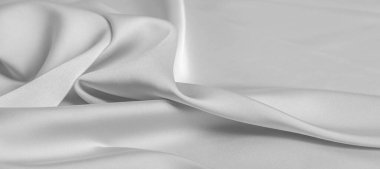 arka plan dokusu, desen. Beyaz ipek kumaş. Pürüzsüz bir mat kaplamaya sahiptir ve gücünü hafif bükümlü ipliklerden alır. her şey için bu lüks kumaş kullanın