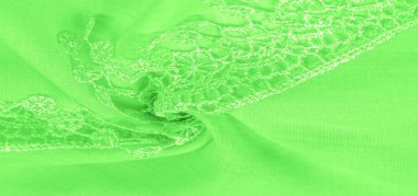 Doku, arkaplan, desen, kartpostal, ipek kumaş, dantel ambalajlı kadın bahar yeşil atkısı. Yazdırma ve dijital materyallerinizi oluşturmak için bu süslü resimleri kullanın.