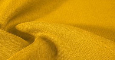 Arka plan dokusu, desen. Metalik pullu sarı kumaş. Bu güzel, hafif pullu kumaşın notaları, pullu aksanı ve güzel bir tasarımı var. Ayrıca güzel bir parıltısı var..
