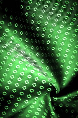 Arka plan dokusu, zümrüt yeşili kumaş rengi ince, güçlü, yumuşak, parlak lif kozaların üretiminde ipek böcekleri tarafından elde edilir ve iplik ve kumaş üretimi için birleştirilir..