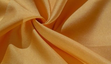 Doku, arka plan, ipek kumaş, sarı kehribar. Fotoğraf, bir moda tasarımcısının tasarımı, pazarlaması, mimarisi, çizimi, yerleşimi, çevresi için tasarlanmıştır.