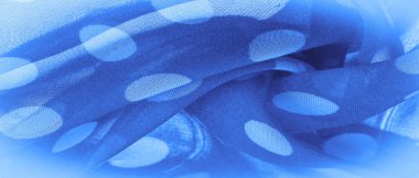 Arkaplan dokusu, dekoratif süs, mavi benekli ipek kumaş, kumaşın şekli veya silindiri andıran yuvarlak noktalar..