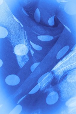 Arkaplan dokusu, dekoratif süs, mavi benekli ipek kumaş, kumaşın şekli veya silindiri andıran yuvarlak noktalar..