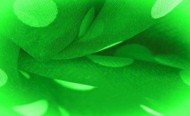 Arkaplan dokusu, dekoratif süs, yeşil benekli kumaş, kumaş üzerindeki yuvarlak noktalar şekilli ya da yaklaşık olarak bir daire ya da silindir gibi..