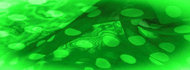 Arkaplan dokusu, dekoratif süs, yeşil benekli kumaş, kumaş üzerindeki yuvarlak noktalar şekilli ya da yaklaşık olarak bir daire ya da silindir gibi..