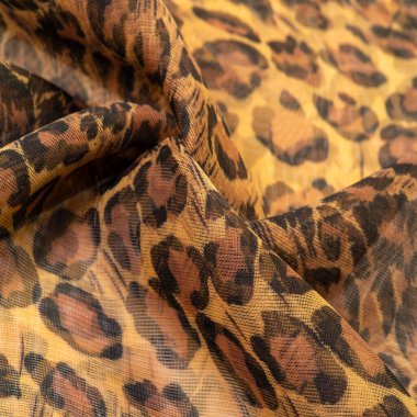 doku, ipek kumaş, leopar derisi, kahverengi-sarı siyah tonlar, sıcak Afrika safarisi,