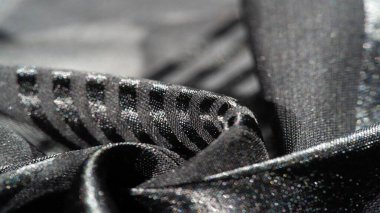 Arka plan dokusu, desen, koleksiyon, farklı boyutlarda çizgileri olan şeffaf ipek kumaş, siyah, zarif lüks.