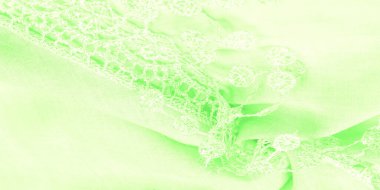 Doku, arkaplan, desen, kartpostal, ipek kumaş, dantel ambalajlı kadın bahar yeşil atkısı. Yazdırma ve dijital materyallerinizi oluşturmak için bu süslü resimleri kullanın.