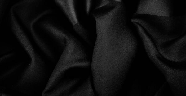 Текстура, фон, узор, черная шелковая ткань, это шелковое атласное плетение. Различается плотностью, гладкостью и блеском передней стороны, мягкостью, хорошо драпируется. Использование дизайн, проекты