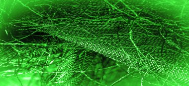 Arkaplan dokusu, dekoratif süs, yeşil ipek kumaş, kumaşta dokuma iplikleri, kabarık efekt, his, görünüş veya yüzey dokusu