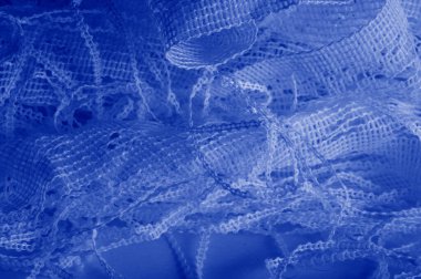 Doku, arka plan mavi tül. Bu olağanüstü naylon tülü kullanarak bir aksesuara hacim, yetenek ya da detaylı tasarım ayrıntıları ekleyin! Yumuşak tül tasarım gereksinimlerinizi karşılıyorsa, diğer kalıplara bakın