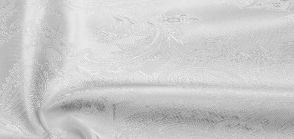 面料背景丝绸面料黑色白色豪华柔软的丝绸手是黑色和白色的帕斯莱图案事实上 印章印刷与液体拉制相结合 除了别致的设计外 什么也没有 — 图库照片