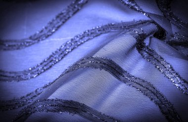 Doku arkaplan resmi, kumaş şeffaf koyu mavi, parlak doğuştan gelen çizgilerle, ışığın içinden geçmesine izin veren madde, böylece nesneler açıkça görülebilir..