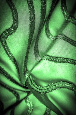 Doku arkaplan resmi. Kumaş şeffaf zümrüt yeşili. Parlak doğuştan gelen çizgileri var..