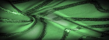 Doku arkaplan resmi. Kumaş şeffaf zümrüt yeşili. Parlak doğuştan gelen çizgileri var..