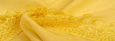 Doku, arkaplan, desen, kartpostal, ipek kumaş, dantel ambalajlı kadın sarı atkısı. Yazdırma ve dijital materyallerinizi oluşturmak için bu süslü resimleri kullanın.