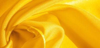 Doku, arka plan, desen, sarı ipek kumaş. Bu ipek inanılmaz derecede zarif. Bu yapılan projeler uzun bir süre sürecek ve hala oldukça iyi durumda olacak.