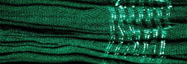 Arka plan resminin dokusu suyun altındaki kumaşın rengi, yeşil-mavi kıvrımlı kumaş, paralel veya çapraz kıvrımlı, tırtıklı katlı kumaş; böyle bir kumaştan çıkan ürünler..