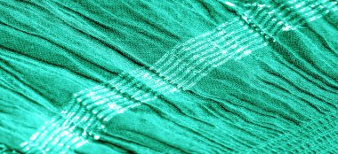 Arka plan resminin dokusu suyun altındaki kumaşın rengi, yeşil-mavi kıvrımlı kumaş, paralel veya çapraz kıvrımlı, tırtıklı katlı kumaş; böyle bir kumaştan çıkan ürünler..