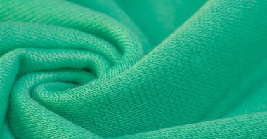 Arka plan, doku, desen, yeşil yün kumaş, ince kıvırcık saç, koyun, keçi ya da benzeri bir hayvanın saçını oluşturan dalgalı saç, özellikle kumaş ya da iplik üretiminde kullanıldıklarında.