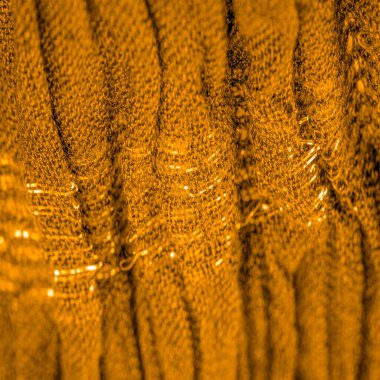 Arkaplan deseninin dokusu, süs süsü, altın sarısı kıvrımlı kumaş, paralel ya da çapraz kıvrımlı kumaş; böyle bir kumaştan çıkan ürünler.