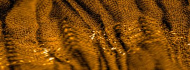 Arkaplan deseninin dokusu, süs süsü, altın sarısı kıvrımlı kumaş, paralel ya da çapraz kıvrımlı kumaş; böyle bir kumaştan çıkan ürünler.