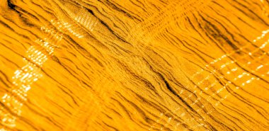 Arkaplan deseninin dokusu, süs süsü, altın sarısı kıvrımlı kumaş, paralel ya da çapraz kıvrımlı kumaş; böyle bir kumaştan çıkan ürünler.