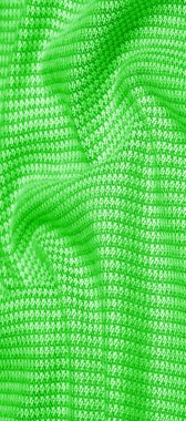 Arka plan dokusu, desenli kumaş, dikişli yeşil iplikli sıcak yün. Klasiklerden etkilenenler için zeytin, yeşil ve zümrütle harmanlanmış bu bağbozumundan esinlensinler.