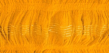 Arkaplan deseninin dokusu, süs süsü, altın sarısı kıvrımlı kumaş, paralel ya da çapraz kıvrımlı kumaş; böyle bir kumaştan çıkan ürünler.