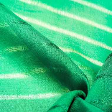 Doku, arkaplan, desen, çizgili basit yeşil kumaş. İpliğin çıkarılması ile oluşan çizgiler,