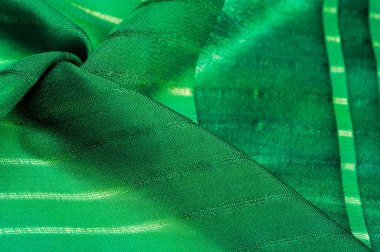Doku, arkaplan, desen, çizgili basit yeşil kumaş. İpliğin çıkarılması ile oluşan çizgiler,