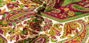 Arka plan dokusu, desen, desenli kumaş pamuk. Özgür Ruh için Kaffe Fassett tarafından tasarlanan bu büyük desenli paletin renk tonları, sıcak pembe, kobalt mavisi, fuşya ve mor ile yeşilin tonlarıdır..