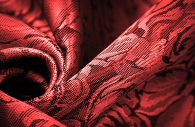 relief pattern, composite textiles, red silk fabric, with a floral pattern, unusually pleasant visual sensations: slippery, coolness, softness; beautiful appearance, unique luster;