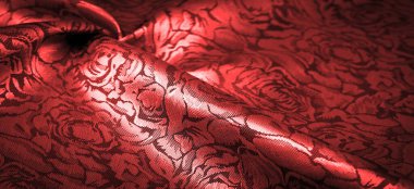 relief pattern, composite textiles, red silk fabric, with a floral pattern, unusually pleasant visual sensations: slippery, coolness, softness; beautiful appearance, unique luster;