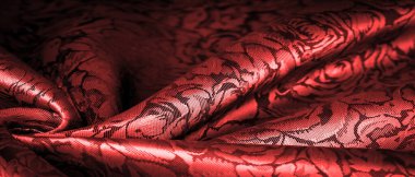 relief pattern, composite textiles, red silk fabric, with a floral pattern, unusually pleasant visual sensations: slippery, coolness, softness; beautiful appearance, unique luster;