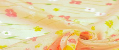 Doku arka planı, ipek kumaş, bej arka planda küçük çiçekler, ince dikiş. Kırmızı, bej renkli ton. Çiçek tasarımı