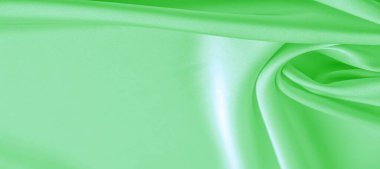 arka plan dokusu, desen. Yeşil zümrüt ipek kumaş. Bu, tasarım stilinize karmaşıklık katar. Yapısal stil özellikleri bazı kararlar, duvar kağıtları, posterler için harika.