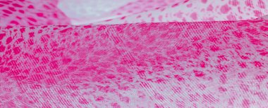 Beyaz kırmızı rengin dokusu, arkaplanı, deseni, ipek kumaşı tekstil. Özellikleri, daha esnek ve tasarlanması daha kolay olduğu için dokuma malzemesinden farklıdır..