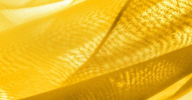 Arka plan dokusu, desen. Metalik pullu sarı kumaş. Bu güzel, hafif pullu kumaşın notaları, pullu aksanı ve güzel bir tasarımı var. Ayrıca güzel bir parıltısı var..