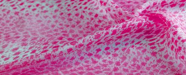 Beyaz kırmızı rengin dokusu, arkaplanı, deseni, ipek kumaşı tekstil. Özellikleri, daha esnek ve tasarlanması daha kolay olduğu için dokuma malzemesinden farklıdır..