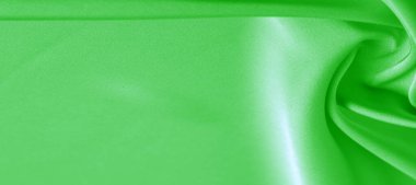 arka plan dokusu, desen. Yeşil zümrüt ipek kumaş. Bu, tasarım stilinize karmaşıklık katar. Yapısal stil özellikleri bazı kararlar, duvar kağıtları, posterler için harika.