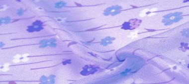 Arkaplan deseni, ipek kumaş, eflatun arkaplanda küçük çiçekler, baskılı ince bir gök mavisi rengi. Çiçek tasarımı