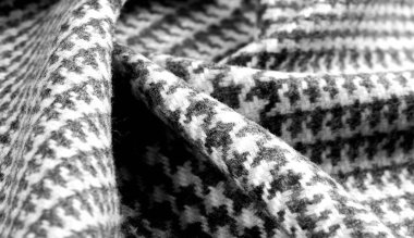 Arka plan dokusu, desen. Kumaş kalın, kareli bir desenle sıcak, gri siyah. Bu kumaşımla unutulmaz bir karşılaşma. En iyi tasarım çözümleri sizi bekliyor..